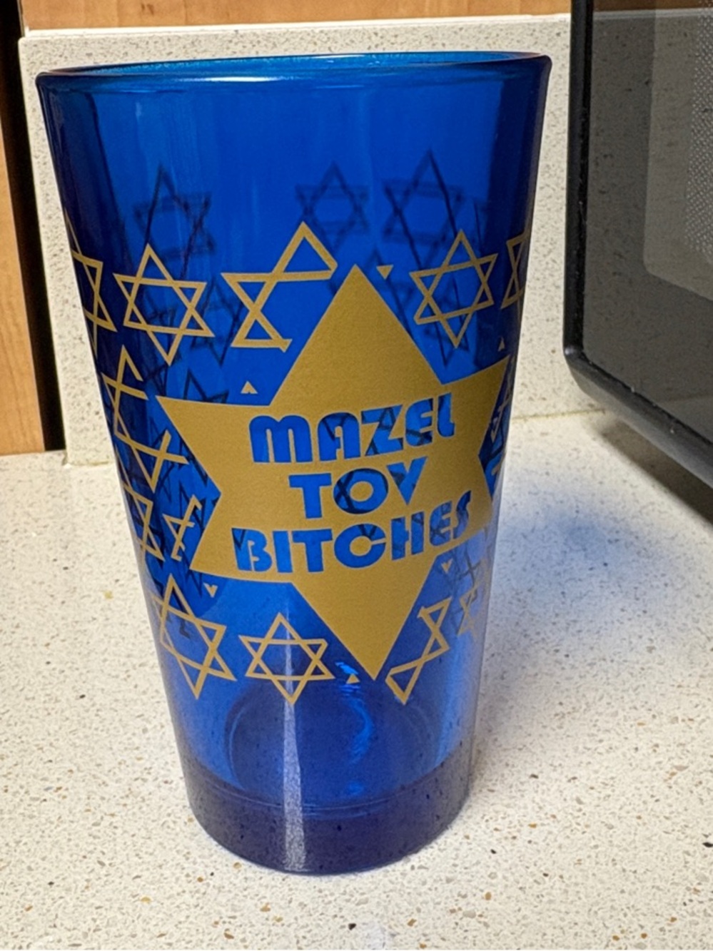 Urban Outfitters Blue Pint Glass with Gold Star and Text